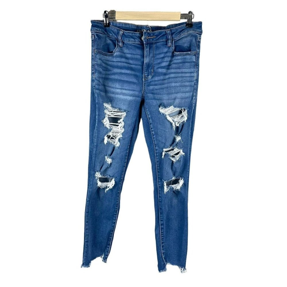 American eagle next level stretch Jegging 14 reg distressed raw hem medium Wash